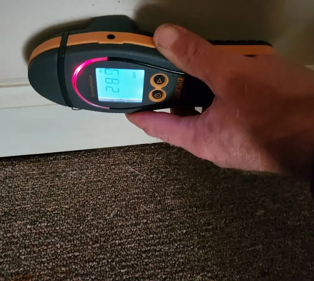 Moisture detection at baseboard during Storm Damage Restoration in Show Low